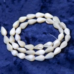 42MP653: Mother Of Pearl Natural Bead Drop 6x9mm 16" String - 40 Piece Per Strand Average
