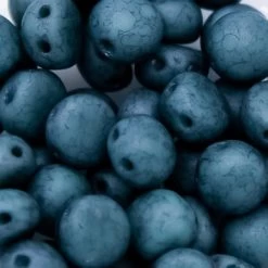 6CA185-94: Preciosa Czech Candy Two Hole Turquoise Green With Pink Effect 6mm - 50 Pieces Per Package