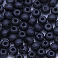 7BN109: Bone Smooth Round Black 7mm Avg 100Pc Bag